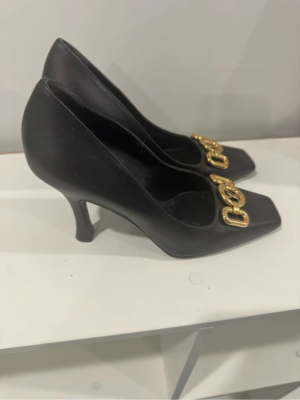Louis Vuitton Black Leather Pumps with Gold LV Chain Accent